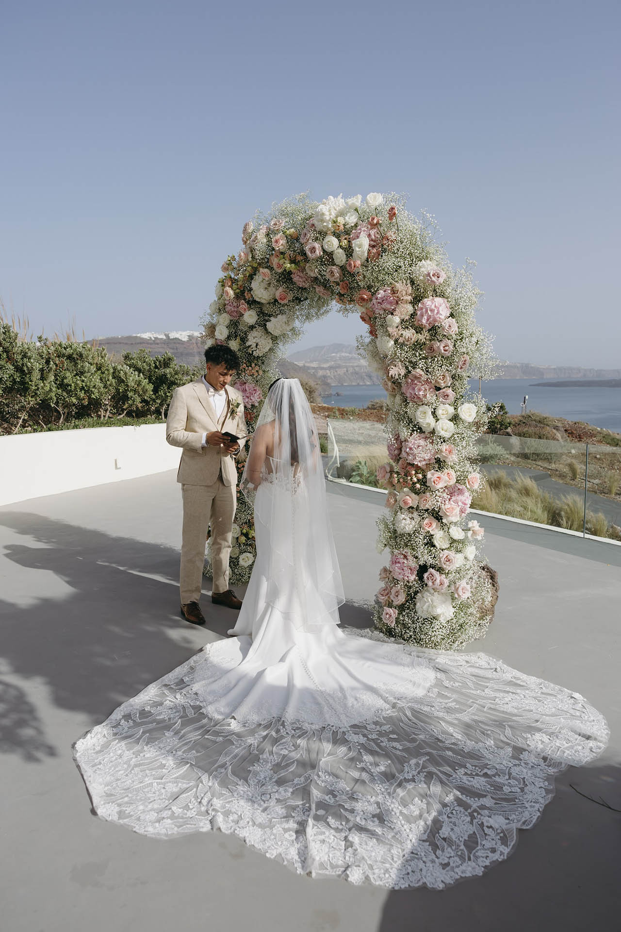 symbolic wedding in Santorini - the couple read the vows