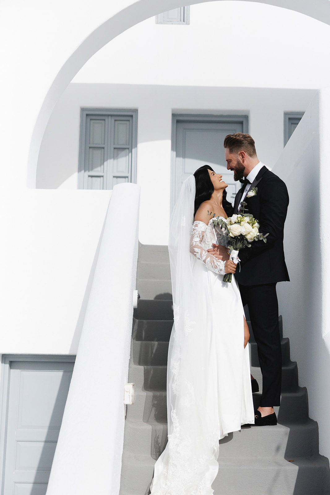 Elegant Wedding in Santorini - Mohini and James at the stairs - Marvellous Wedding