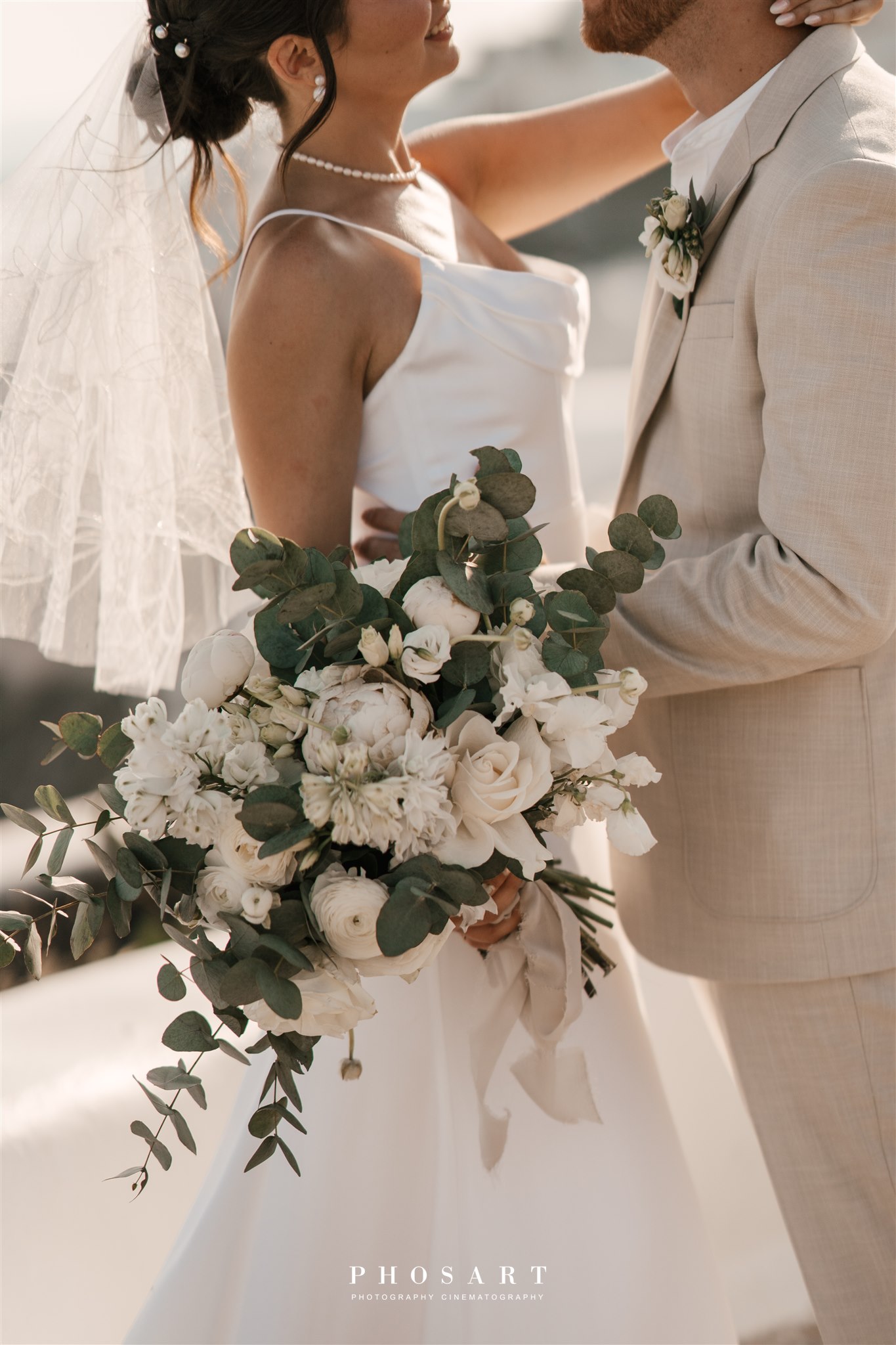 last-minute elopement in Santorini - couple and bridal bouquet