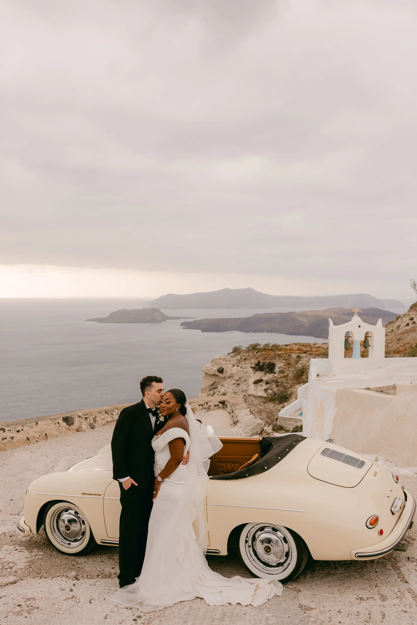 Multicultural Wedding in Santorini - the couple with a view and a vintage car - Marvellous Wedding