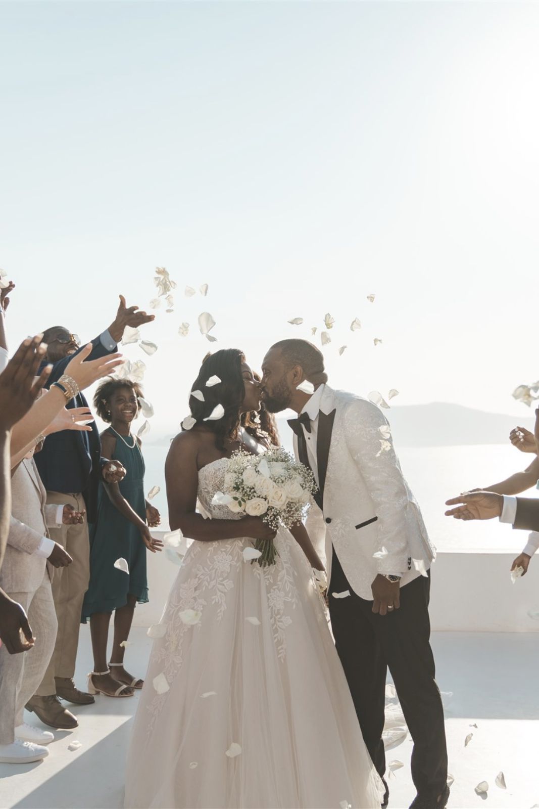 wedding at Dana Villas in Santorini - Groom and bride kiss - Marvellous Wedding