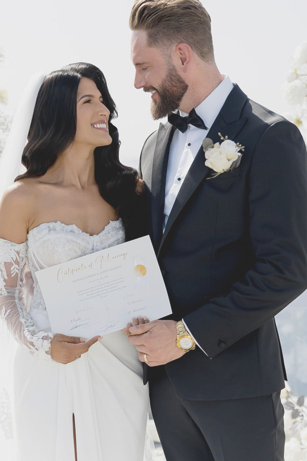 Legal Documents for a Santorini Wedding - the married couple with the legal certificate of their marriage in Santorini - Marvellous wedding