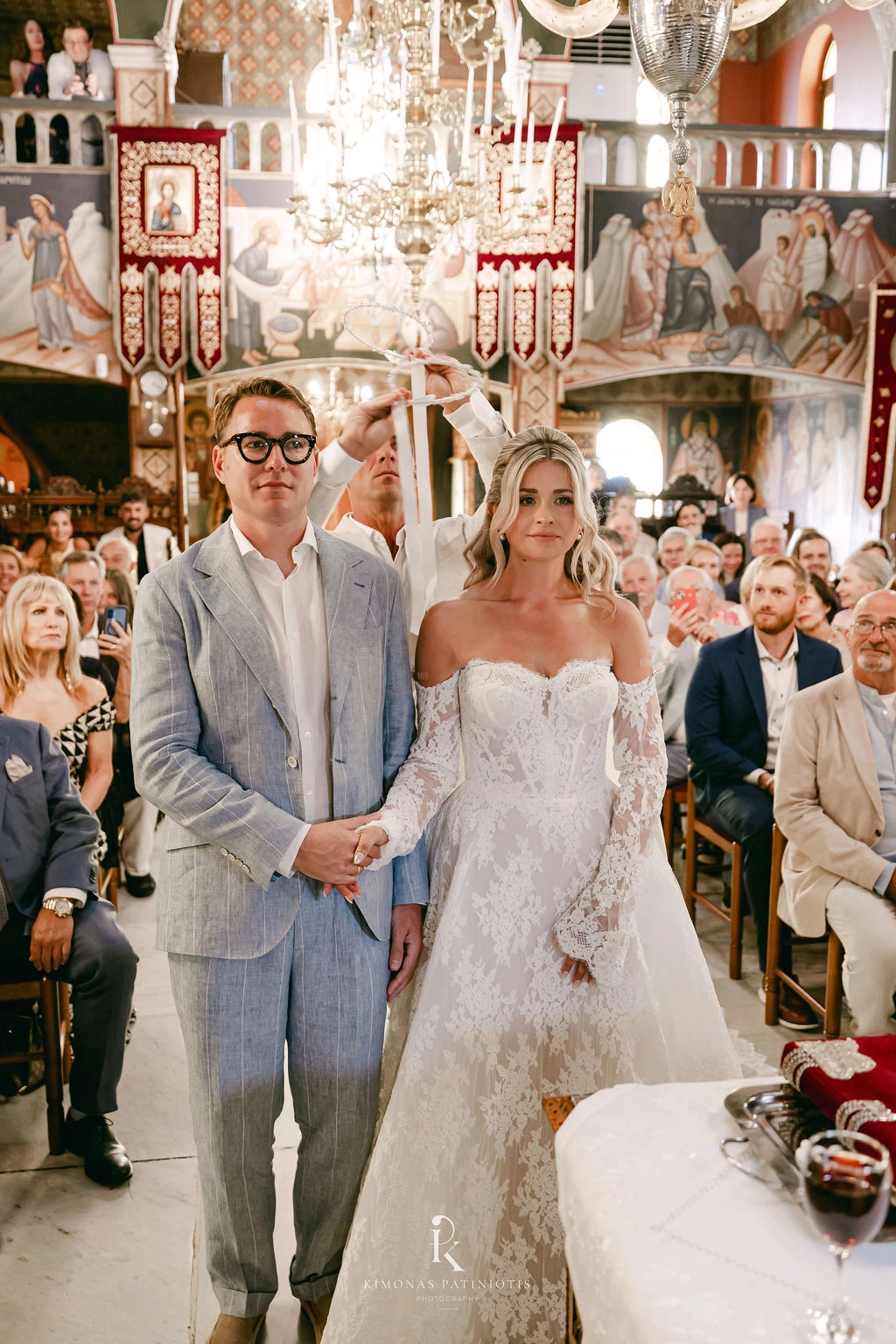 Greek Orthodox Wedding in Santorini - the couple and their wedding crowns - Marvellous Wedding